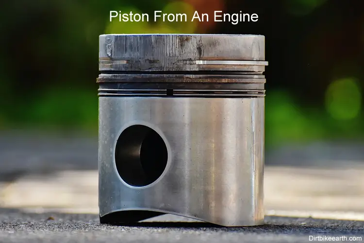 Piston from two stroke engine